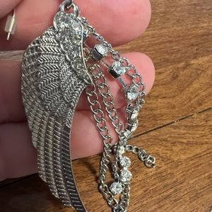 Never worn glamorous angel wing earrings